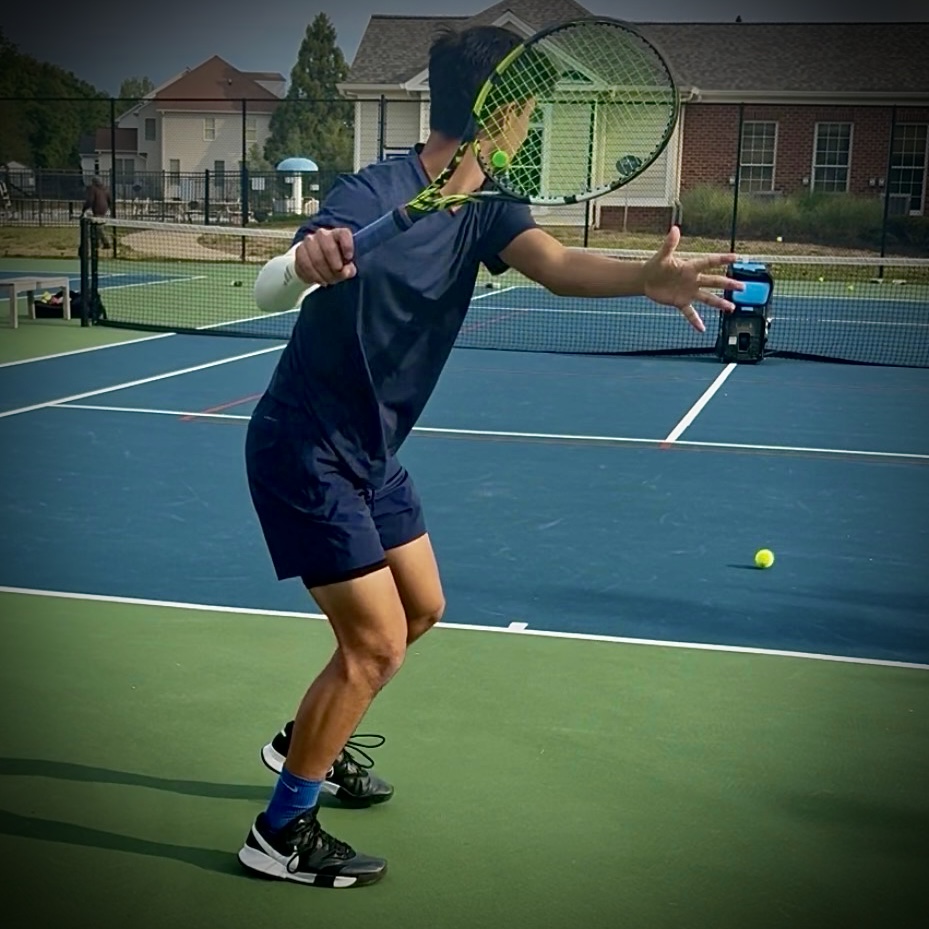 Judah finishing a forehand with full extension